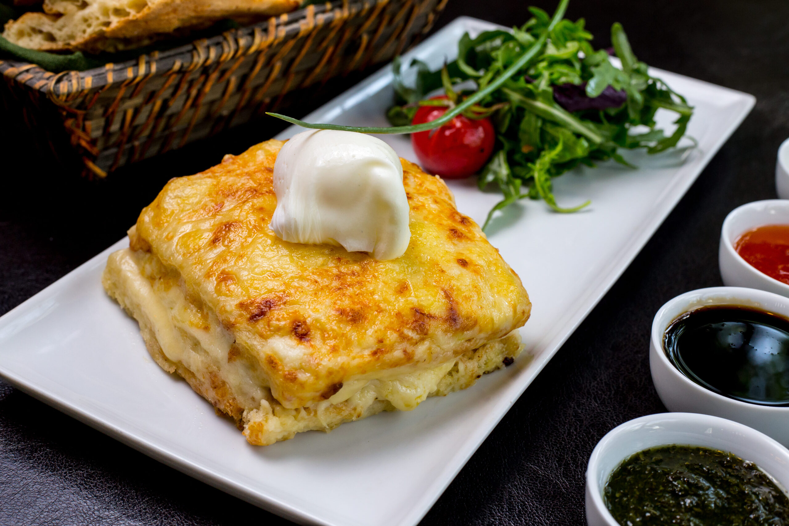 Crispy cheesy hash browns sizzling in a cast-iron skillet, golden edges visible