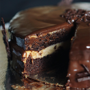 Assembling Chocolate Eclair Cake layers with graham crackers and vanilla pudding in baking dish